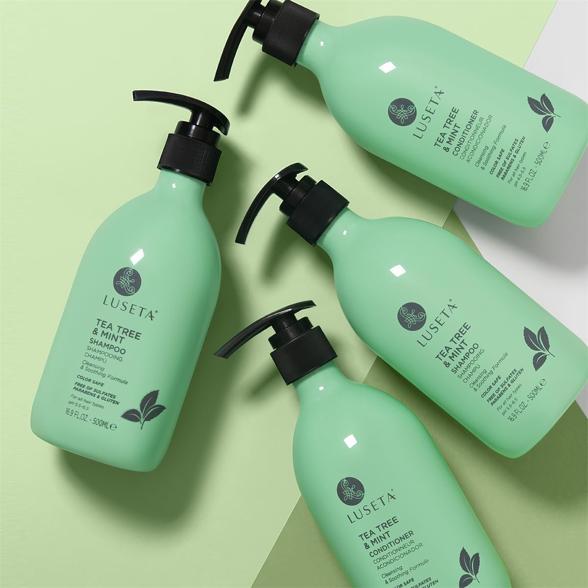 L LUSETA Tea Tree Mint Shampoo and Conditioner set on a wooden table