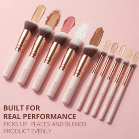 Lamora Kabuki Makeup Brush Set with a backdrop of makeup products
