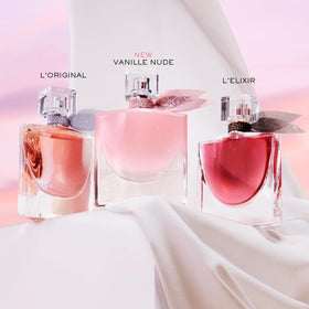 Lancôme La Vie Est Belle Vanille Nude Eau de Parfum with floral background