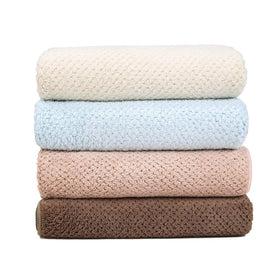Laojbaba Microfiber Hair Towel displayed with hair care products