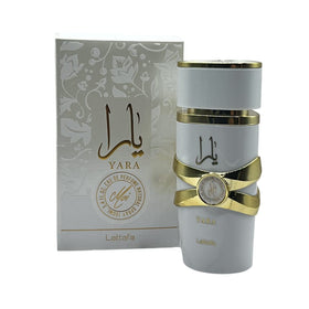 Lattafa Asad fragrance bottle on a wooden surface
