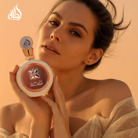Lattafa Fakhar Eau de Parfum 100ml with floral background