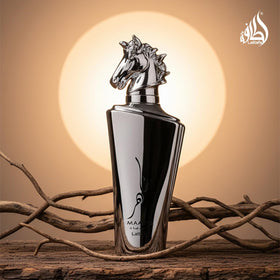 Lattafa Maahir Legacy bottle with lifestyle background