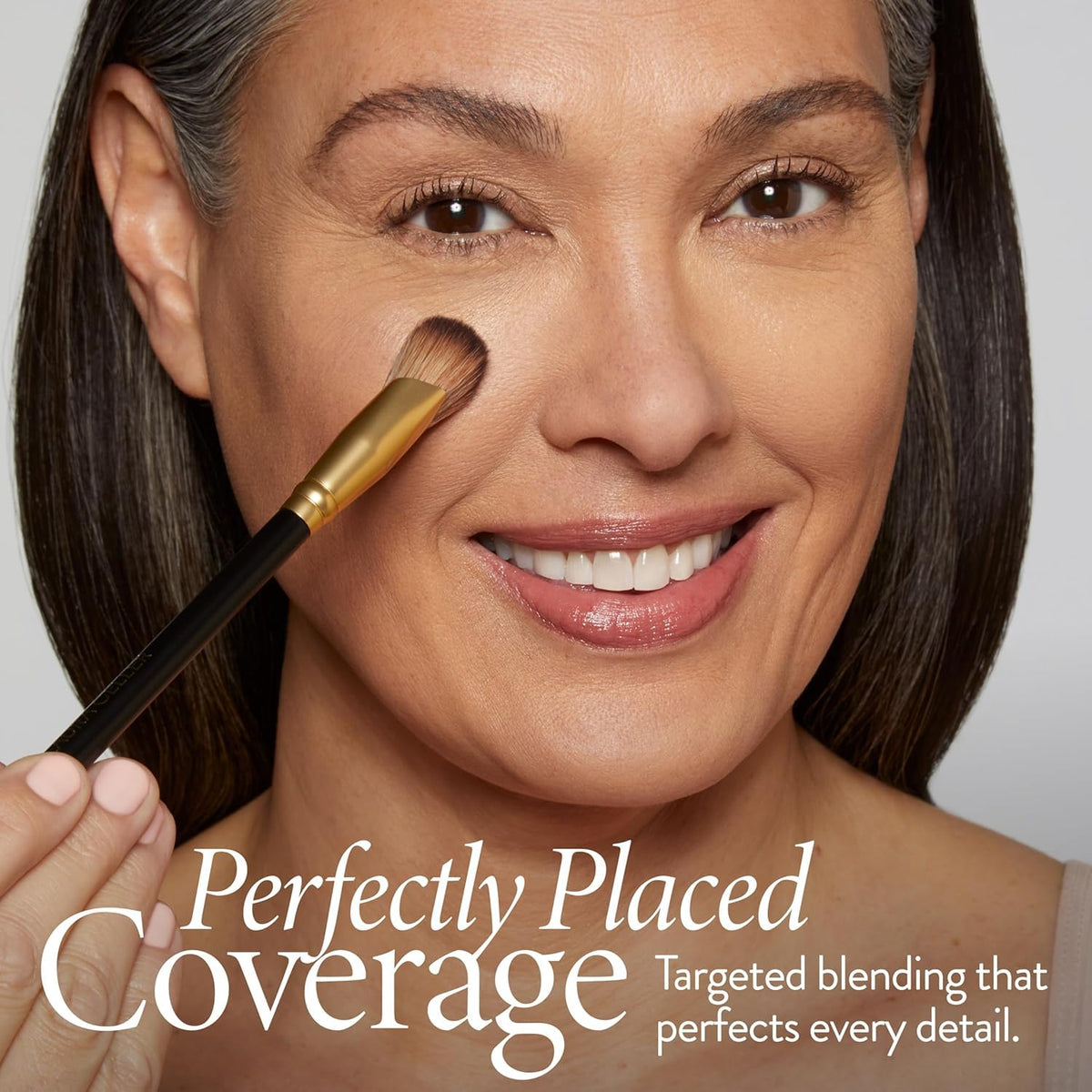 LAURA GELLER Angled Precision Concealer Brush in use on skin