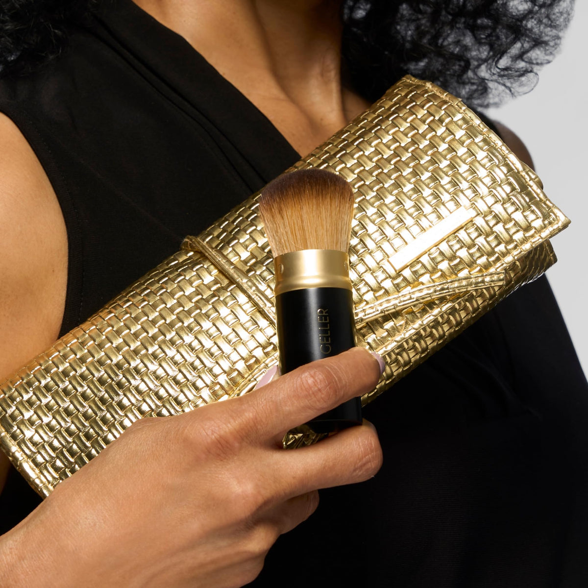 LAURA GELLER Brush Vault brushes displayed on a vanity