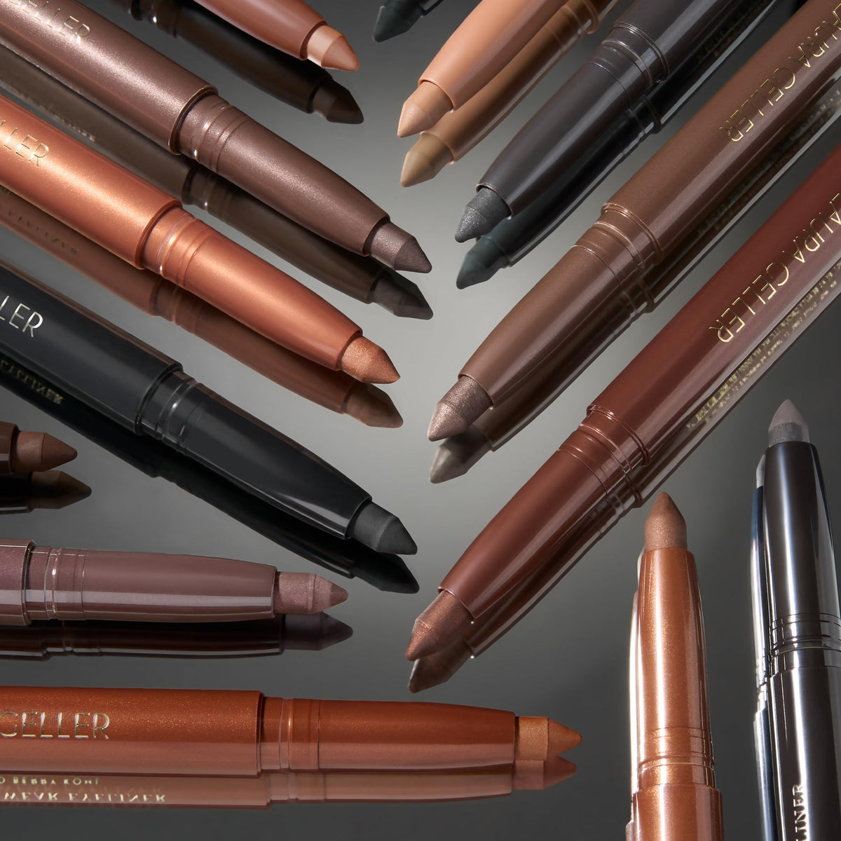 LAURA GELLER NEW YORK Kajal Eyeliner Duo displayed with other makeup products