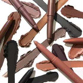 LAURA GELLER NEW YORK Kajal Eyeliner Duo on a makeup vanity