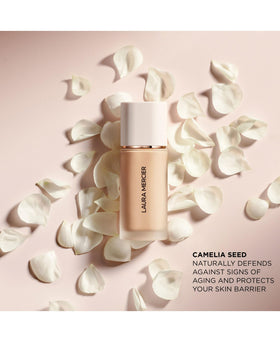 Laura Mercier Real Flawless Liquid Foundation 0N1 Silk in use during makeup application