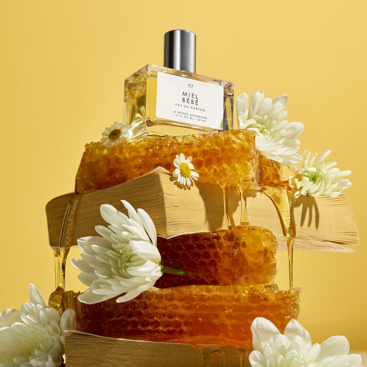 Le Monde Gourmand Miel Bébé Eau de Parfum bottle with a soft background