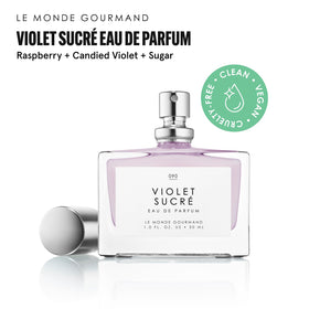 Le Monde Gourmand Violet Sucré perfume bottle with floral background