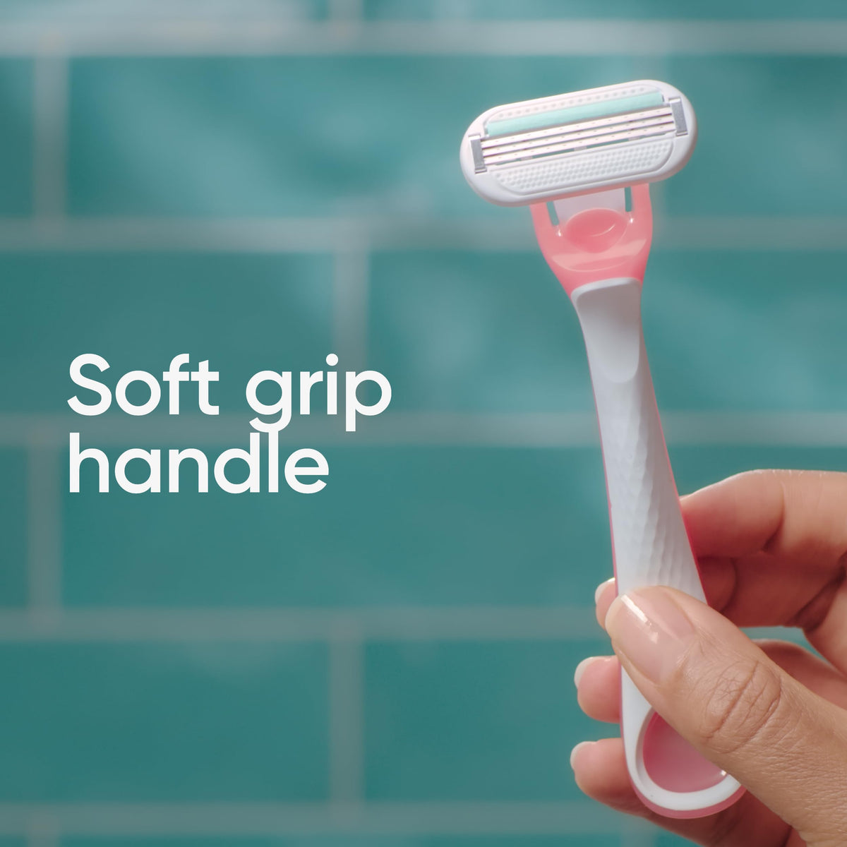 Lifestyle image of a woman using Gillette Venus Sensitive Disposable Razor