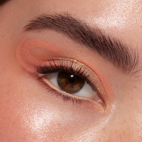Lifestyle image of ColourPop Baby Got Peach Eyeshadow Palette in use