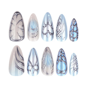 Lifestyle image of CTTHNBD blue press on nails worn on hands