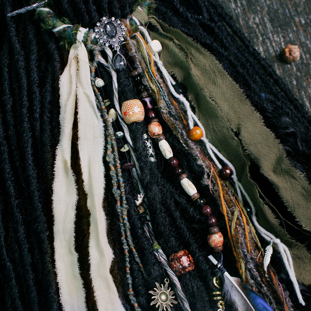 Lifestyle image of dreadlock hair tie in use with braids
