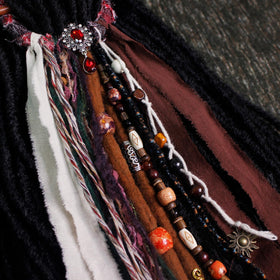 Lifestyle image of dreadlock hair tie worn in hair