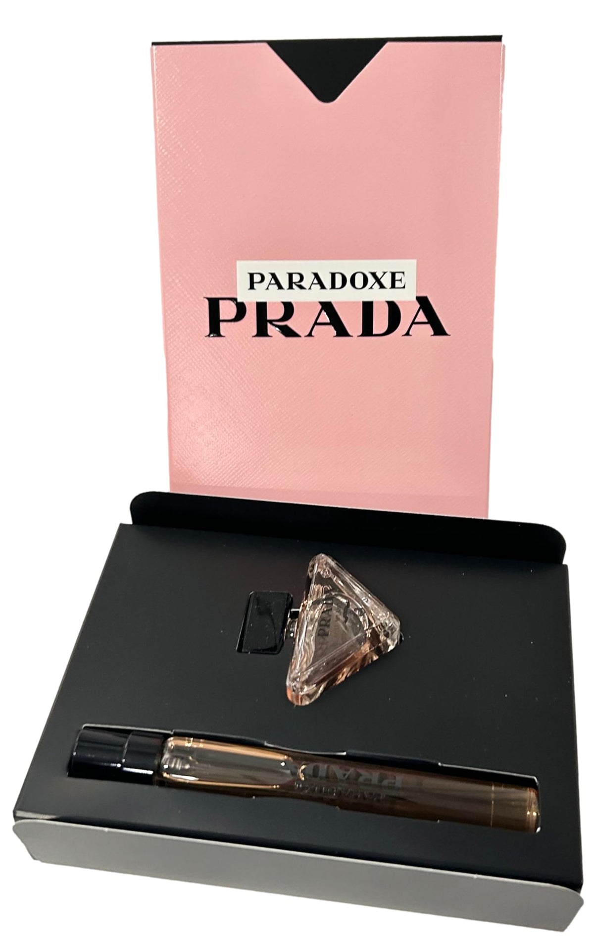 Lifestyle image of Prada Mini Paradoxe set on a vanity