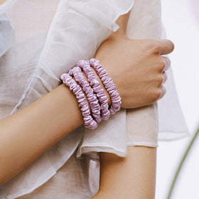 Lifestyle image of SLIP Silk Hair Ties in use on a ponytail