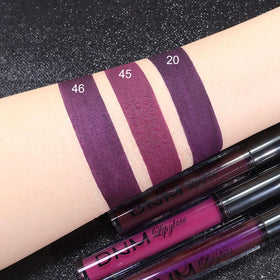 Lifestyle image of woman applying evpct Liquid Lipstick