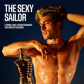 Lifestyle scene featuring Jean Paul Gaultier Le Male Elixir Parfum on a vanity