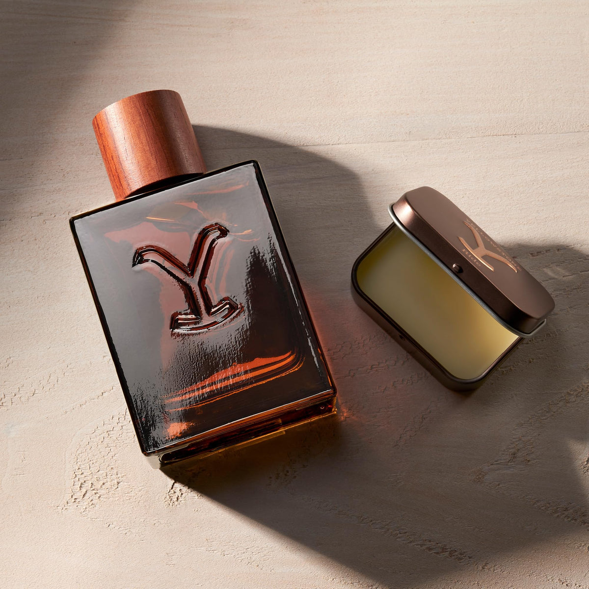 Lifestyle scene of man applying Yellowstone Ride solid cologne