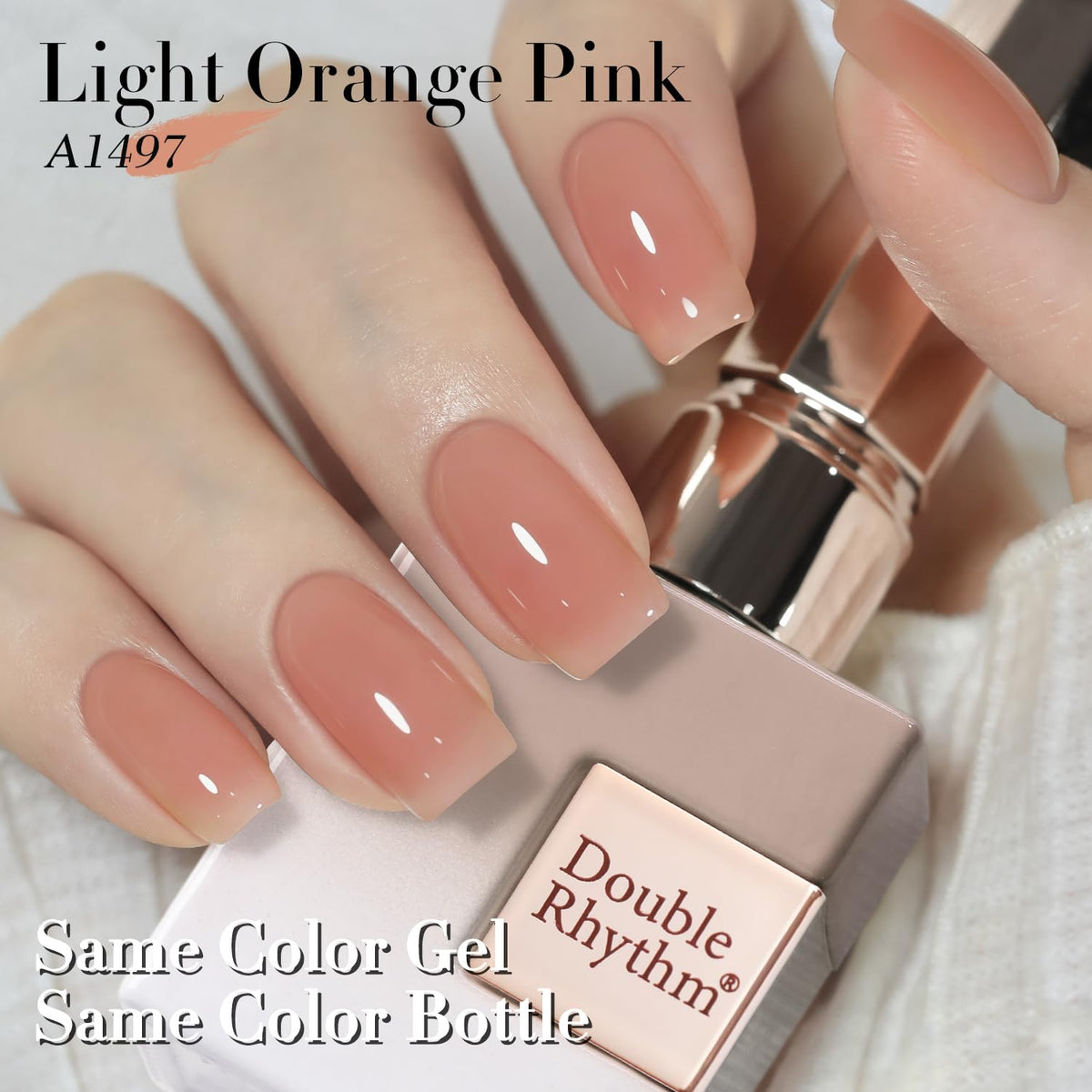 Lifestyle scene showing nails painted with Double Rhythm Gel Polish Light Orange Pink