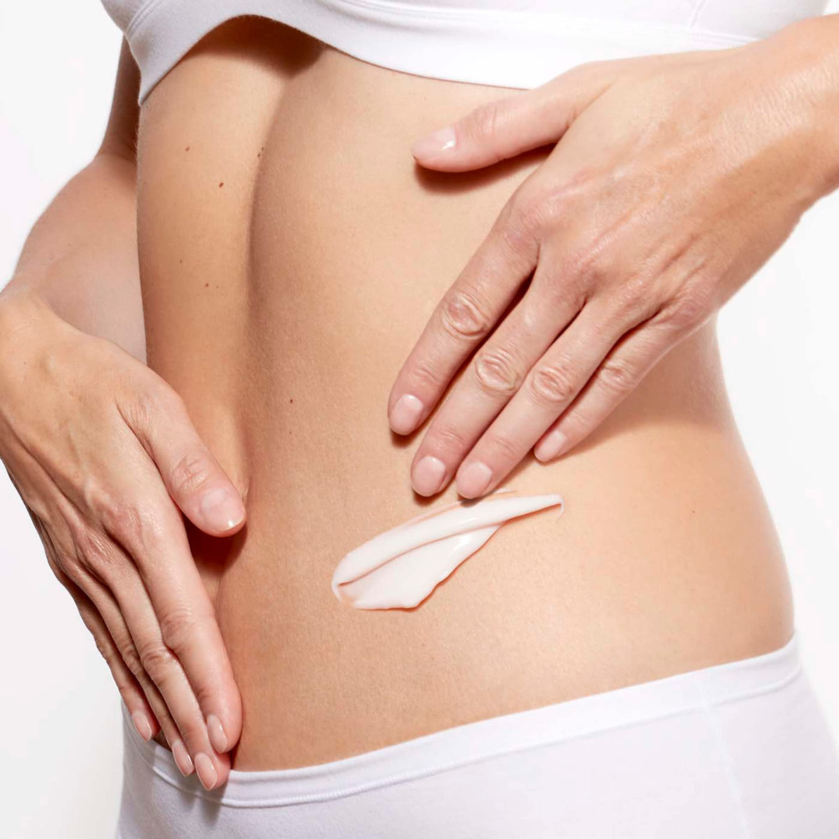 Lifestyle scene using CLARINS Super Restorative Body Cream on skin