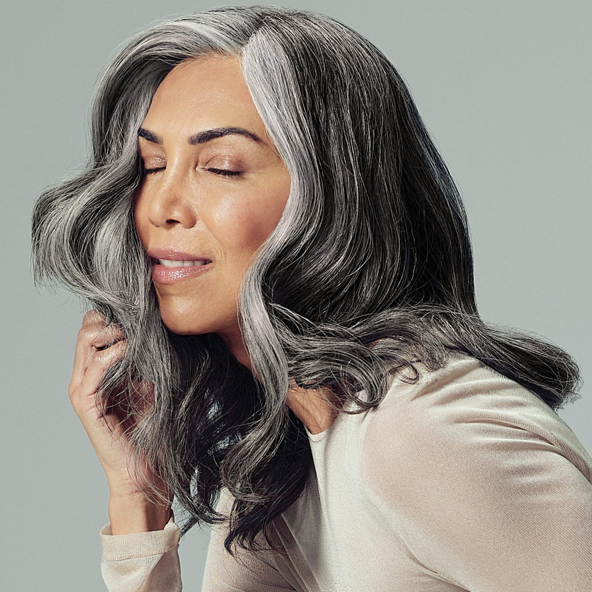 Lifestyle scene with Paul Mitchell Extra-Body Root support Volumizing Spray