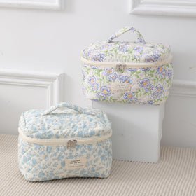 Lifestyle scene with uekeboag Large Travel Quilted Makeup Bag on a vanity