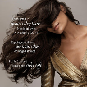 Lifestyle shot of ORIBE Gold Lust Dry Heat Protection Spray on vanity