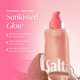 Lifestyle shot of Saltair Shimmering Body Oil on a beach