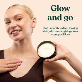 Lifestyle shot of The Body Shop Satsuma Body Butter on a bathroom shelf