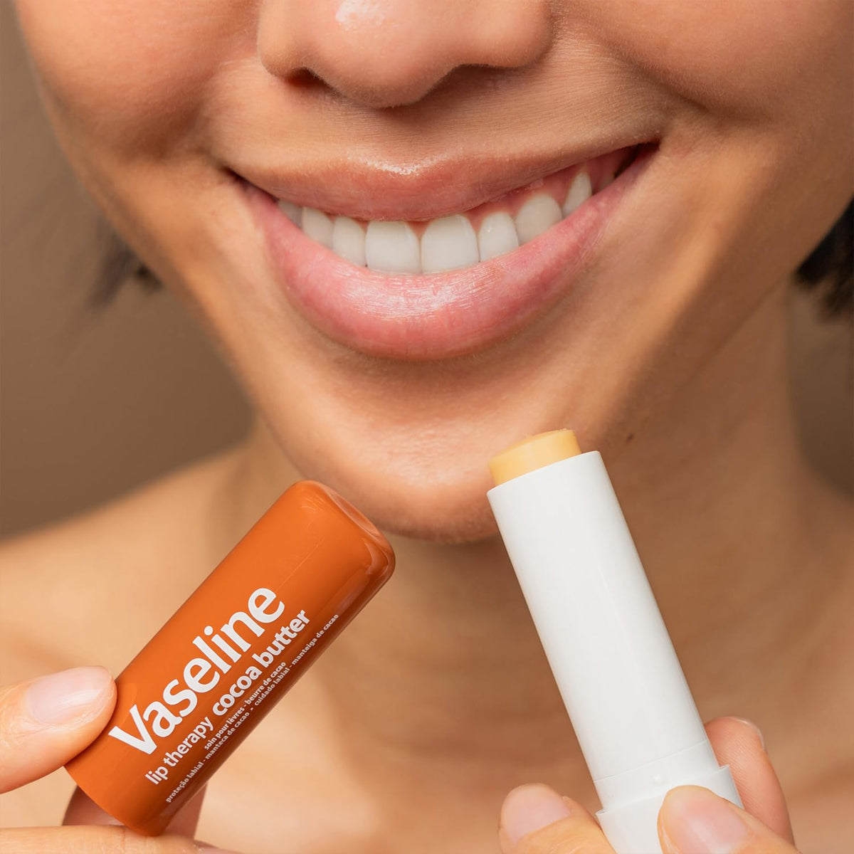 Lifestyle shot of Vaseline Lip Therapy in a bag