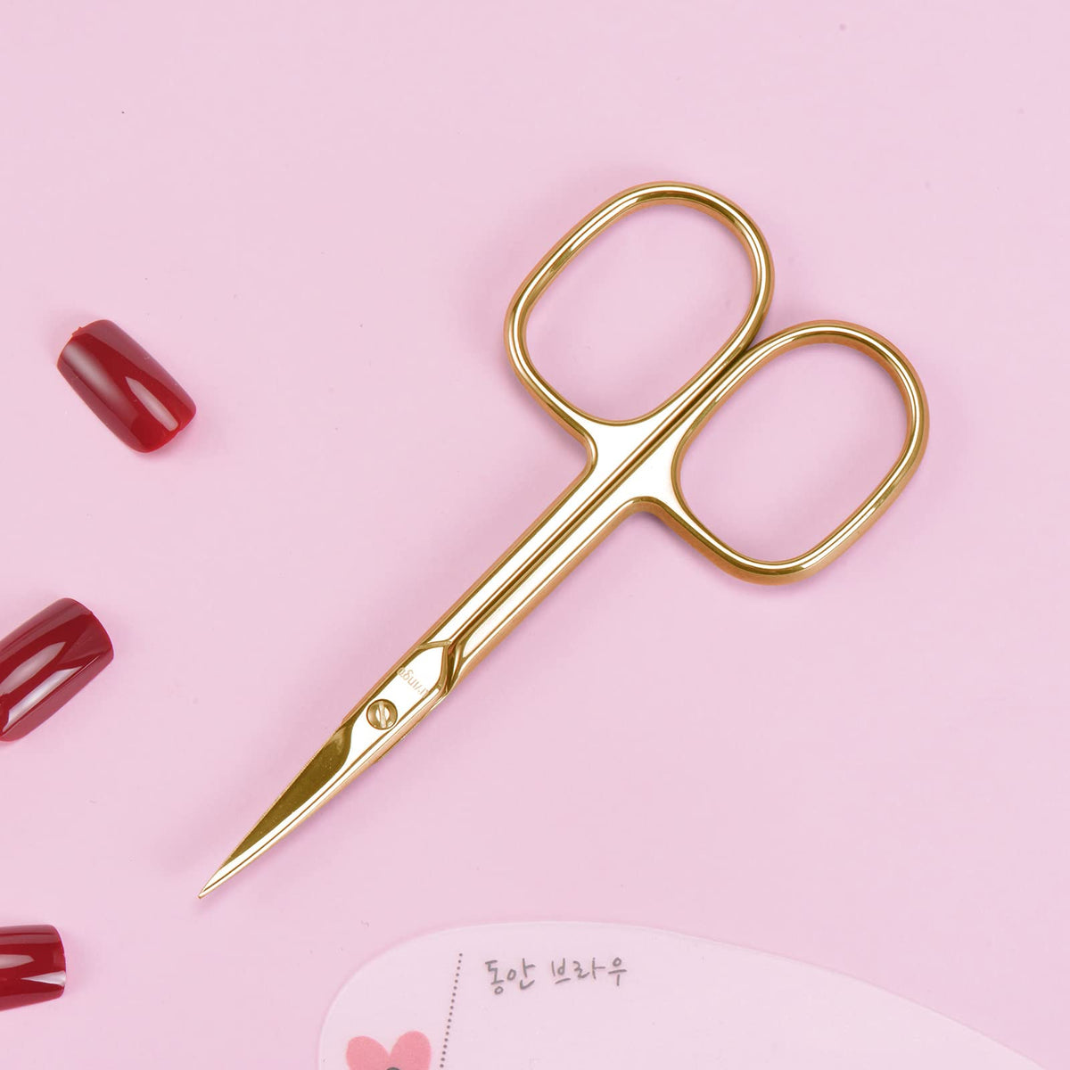 LIVINGO Nail Scissors next to manicure tools