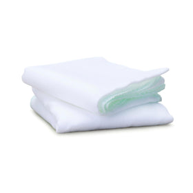 Liz Earle Pure Muslin Cloths laid flat on a surface