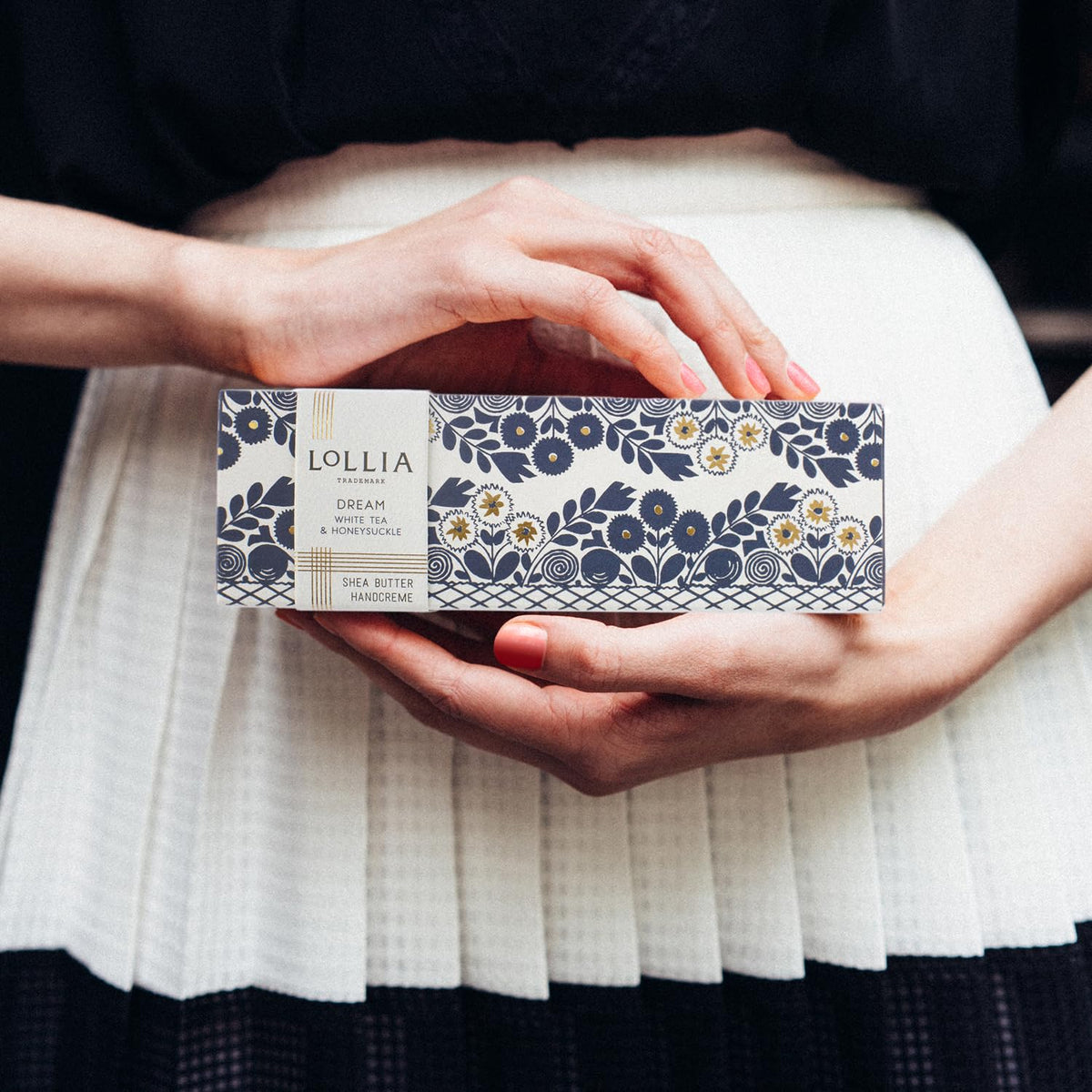 LOLLIA Dream Handcreme packaging on a bathroom shelf
