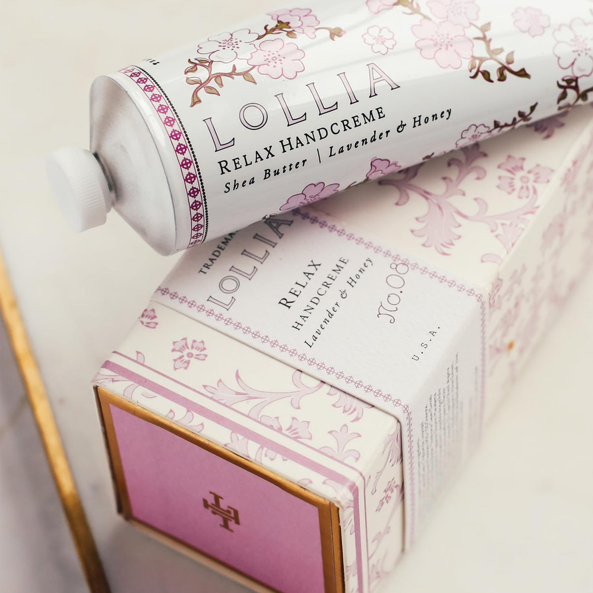 LOLLIA Relax Handcreme 4 oz side view with golden bee design