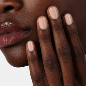LONDONTOWN kur Perfecting Nail Veil Alabaster Tint on a manicure table
