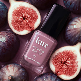 LONDONTOWN Perfecting Nail Veil #11 Fig on a nail care table