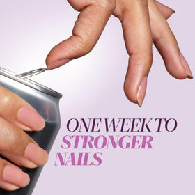 LONDONTOWN Sheer Strength Nail Blush bottle with hand model