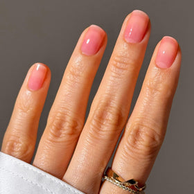 LONDONTOWN Sheer Strength Nail Blush Poppy with other nail care products