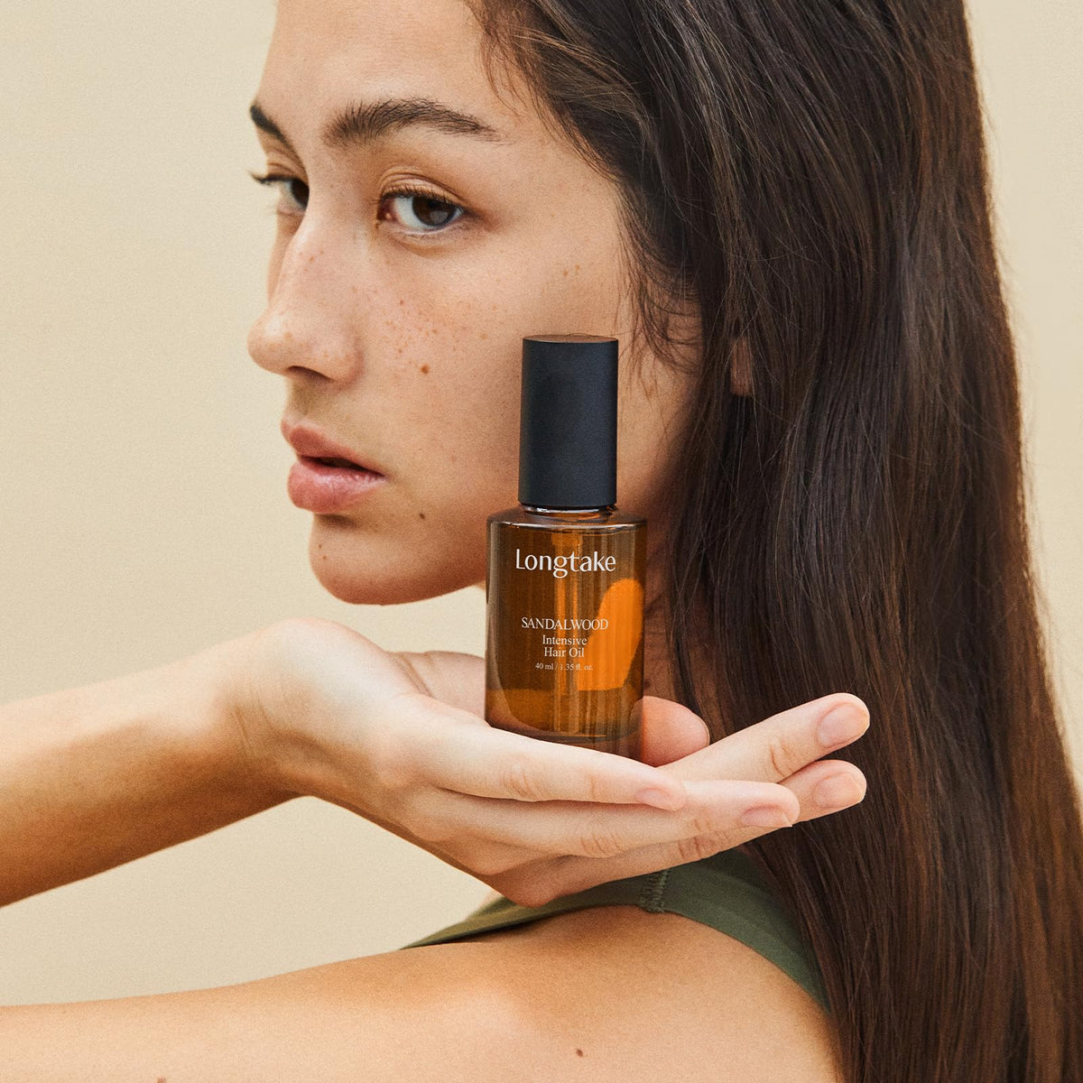 LONGTAKE Hair Fragrance Oil Black Tea & Fig on a vanity