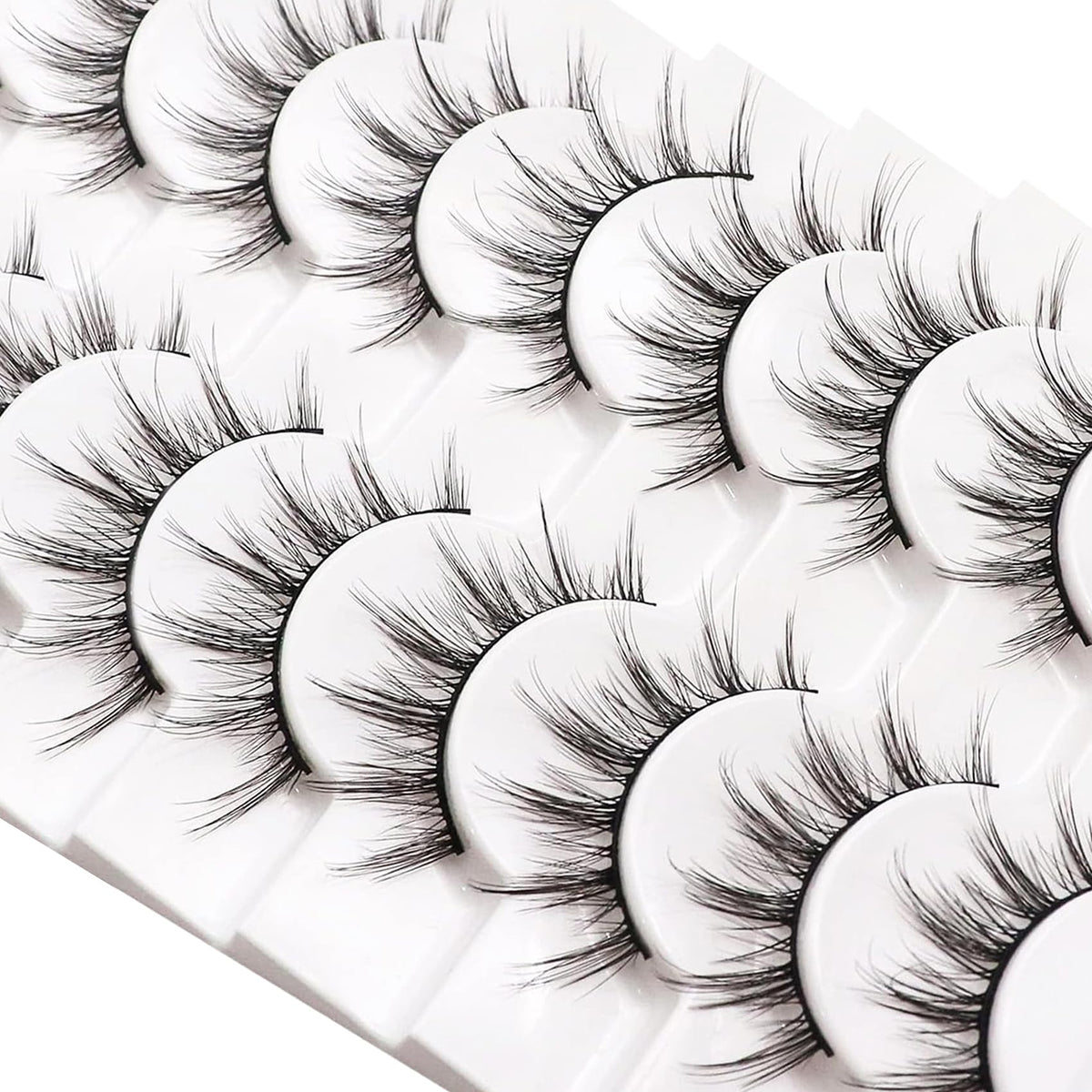 Losha Manga Lashes displayed with makeup accessories