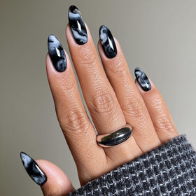 LPOODDNU Almond Press on Nails black marble design front view