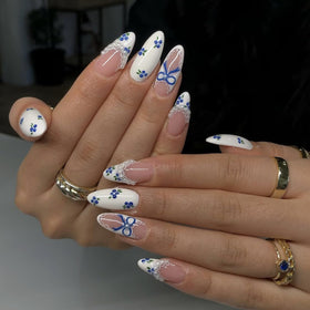 LPOODDNU Blue White Press On Nails Almond different sizes displayed