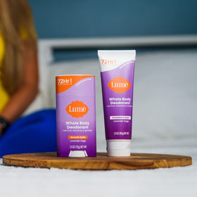 Lume deodorant stick in hand demonstrating application