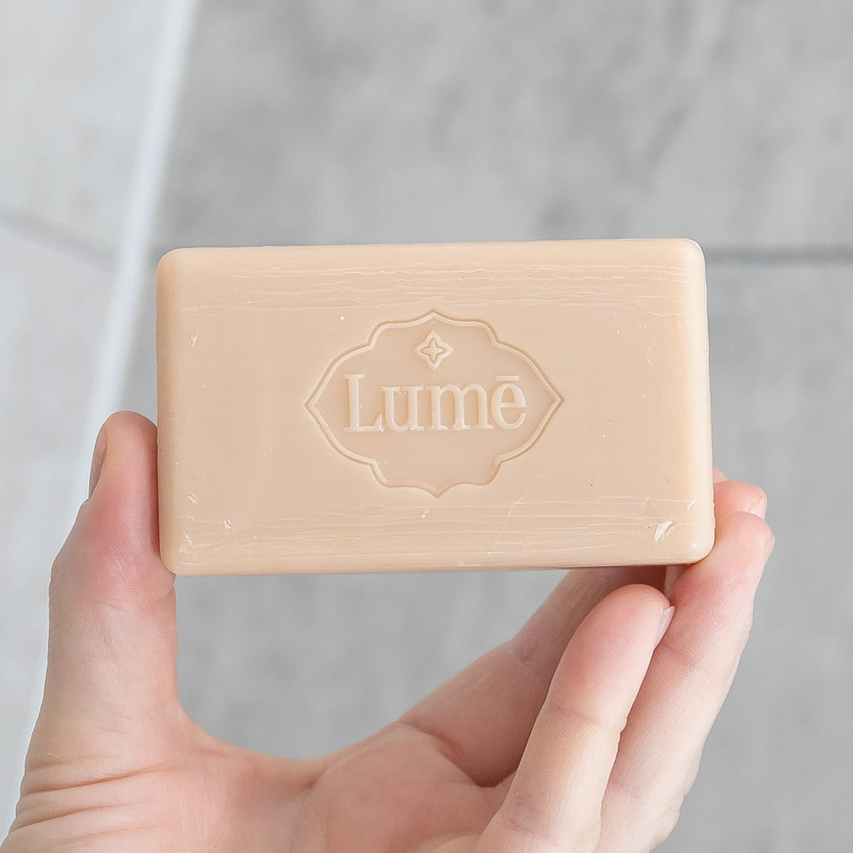 Lume Triple Milled Bar Soap in a bathroom setting