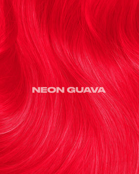 Lunar Tides Neon Guava hair color glowing under blacklight