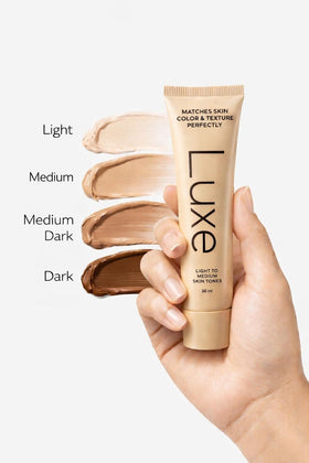 LUXE Color Changing Foundation Medium Dark applied on model