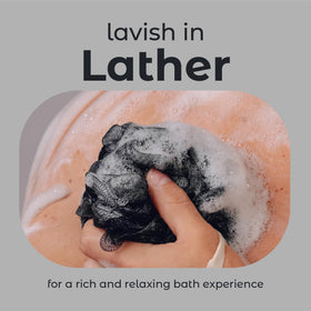 MainBasics Shower Loofah Sponge Pouf in use during a shower