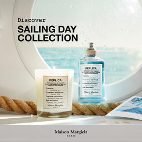 Maison Margiela Replica Sailing Day Eau de Toilette bottle with ocean background